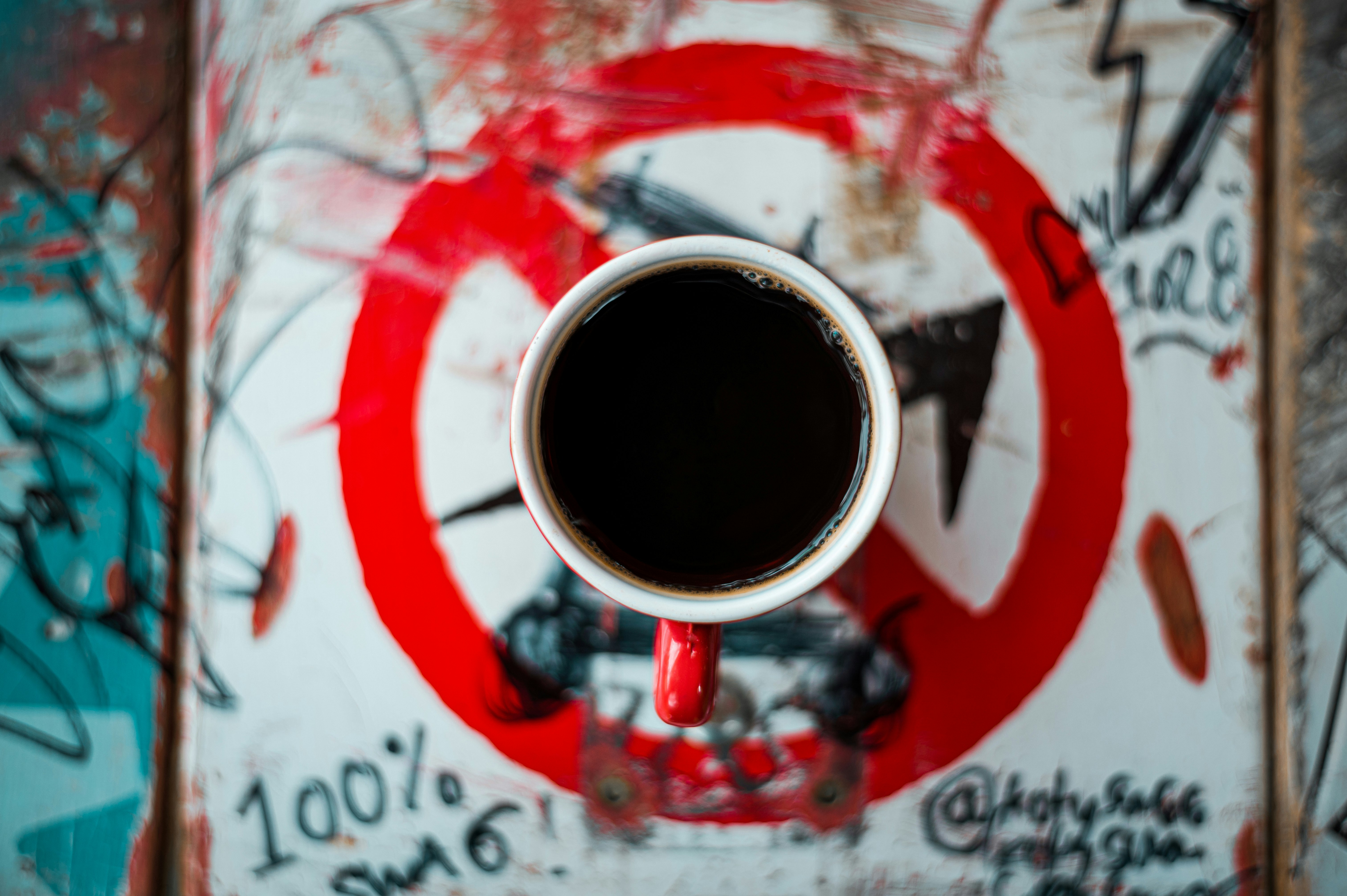 red and white ceramic mug